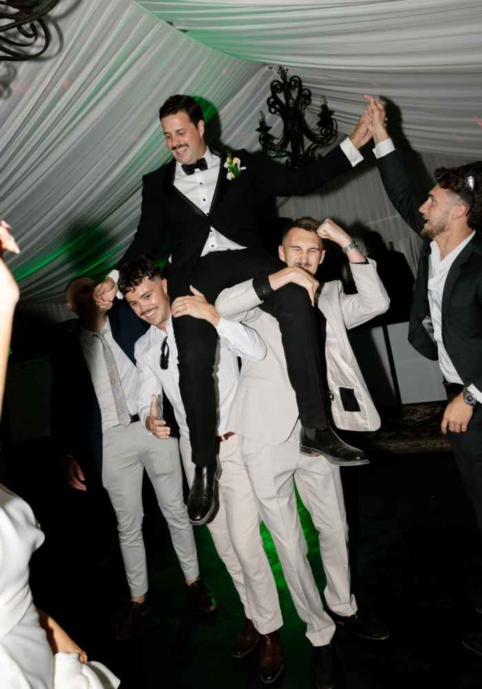 Canberra wedding reception groom entry with friends